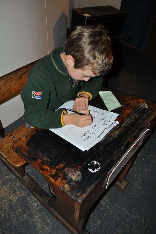 6a. William tries his hand at cursive writing with an ink pen