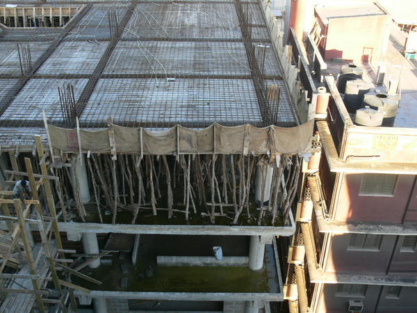 Take a look at how they reinforce the building when they build the next floor.......with sticks!!