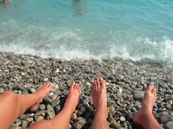 our feet on the rock beach