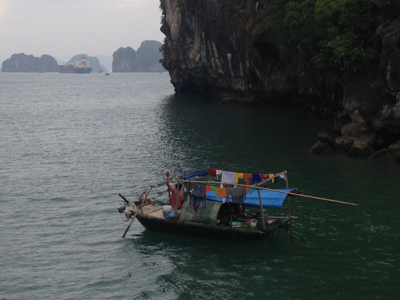 Tiny fishing boats all through Ha Long Bay