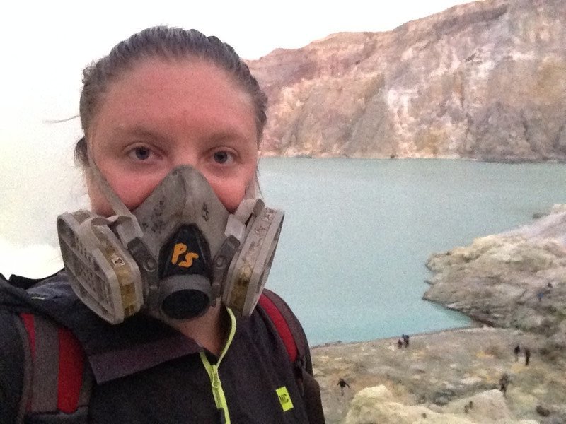 Gas mask and sulfuric acid lake in Ijen crater