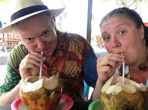 Dad and I pounding fresh coconut water