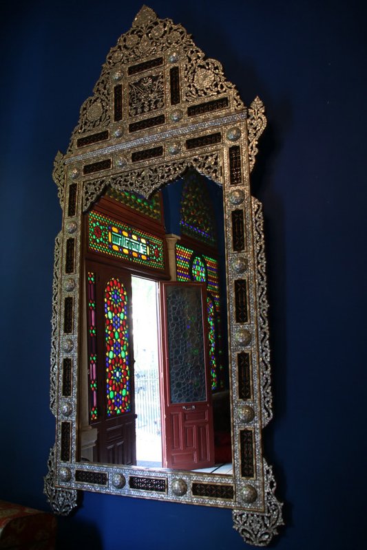 Ornate glass and silverwork, inside a restored mansion