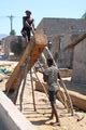 Cutting new roof beams with a two-man saw