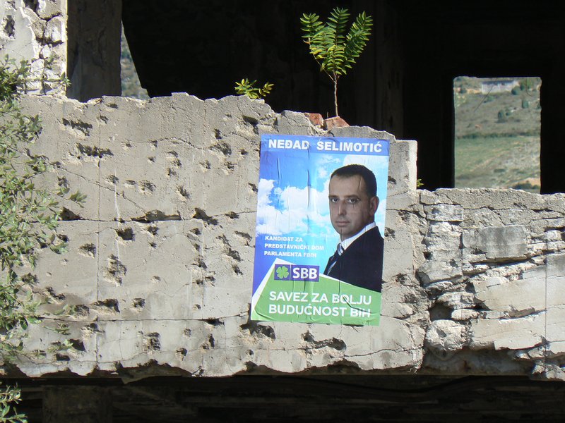 War damage and presidential election poster