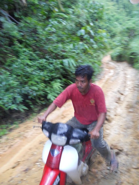 Our Orang Alsi guide arriving by moped