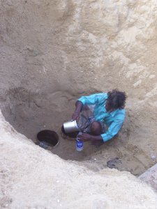 Drinking water from the well on the beach