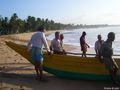 Fishermen pulling their boat - Tangalle beach