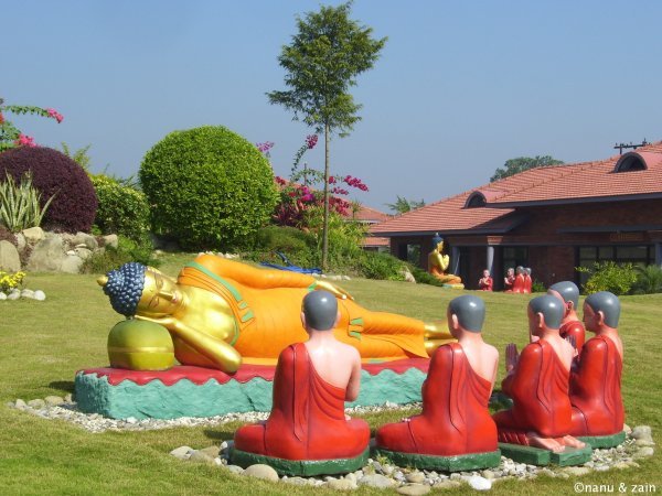 A statue of Lord Buddha and his followers