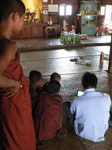 Monks watching DVDs