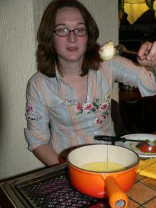Sophie demonstrates how to eat French chesse fondue