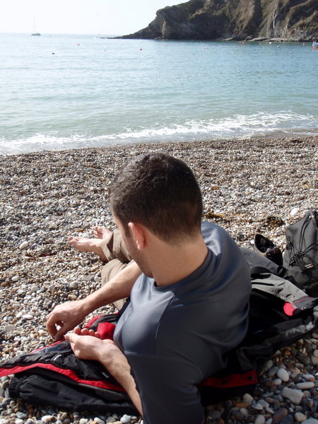 Chris getting some spring sun at Lulworth Cove, Dorset