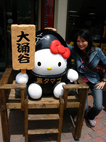 Hello Kitty peeping out of its black shell at Owakudani