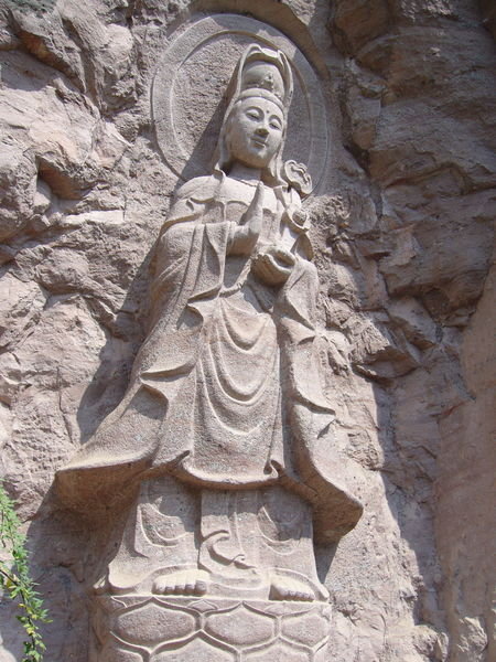 female buddha carved from the rock