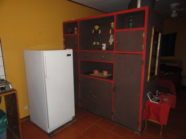 fridge & dividing storage unit between sleeping area from kitchen/eating area