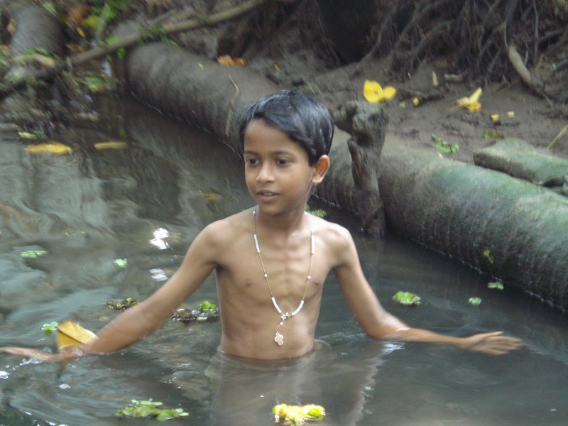 Little boy taking a dip