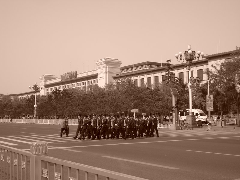 Soldiers marching across to Tiananmen Square