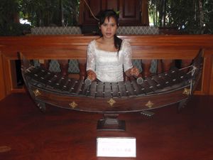 Woman playing traditional Cambodian instrument at our hotel