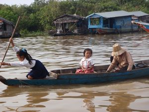 School girl in her uniform paddling | Photo