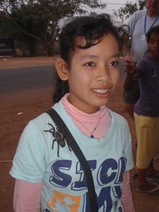 Young girl with live hairy tarantula