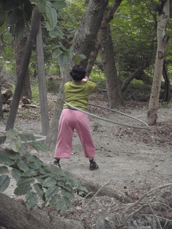 Woman using hula-hoop for exercise