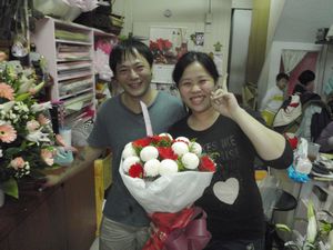 Woman and her husband- owners of the flower shop