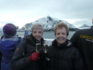 Sheryl and Pam Celebrating the crossing of the Arctic Circle