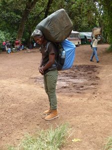 Our 22 porters carrying tents food tables chairs water etc (5)