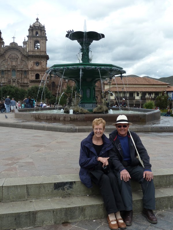 Pam & Tom in front of fountain in main square of Cusco