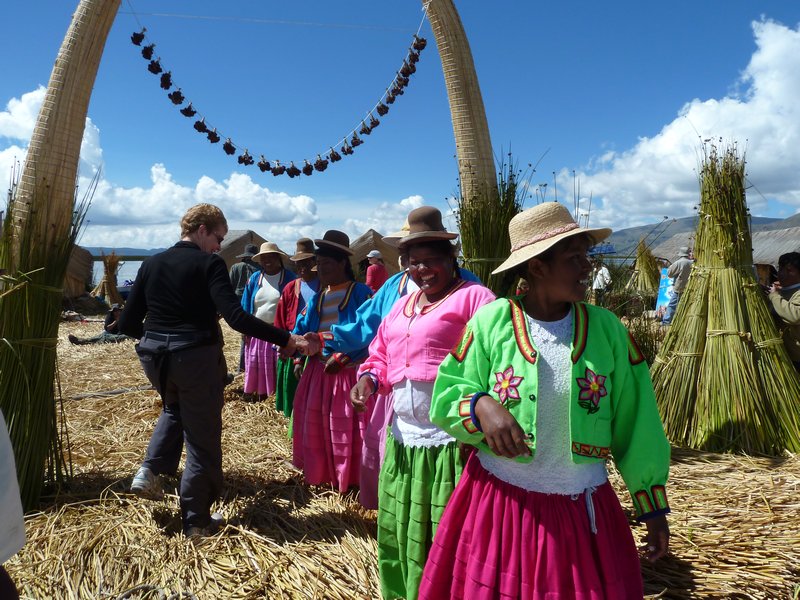 Pam being welcomed by Uros Island locals