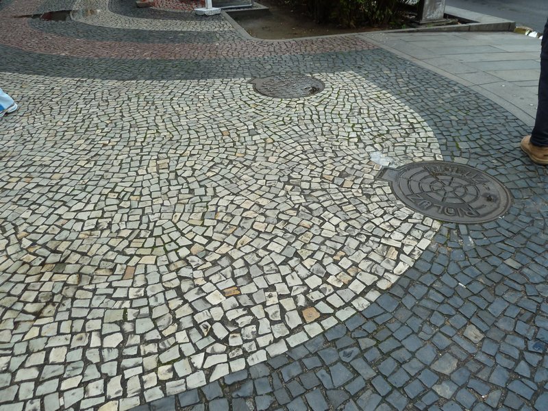 Small pavers (black and white) common in Brazil
