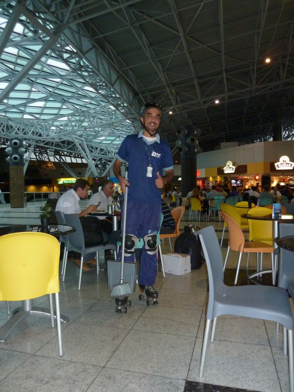Airport cleaner on rollerscates at the Reciffe airport