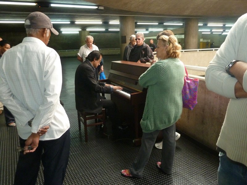 A pianist playing inside the Metro