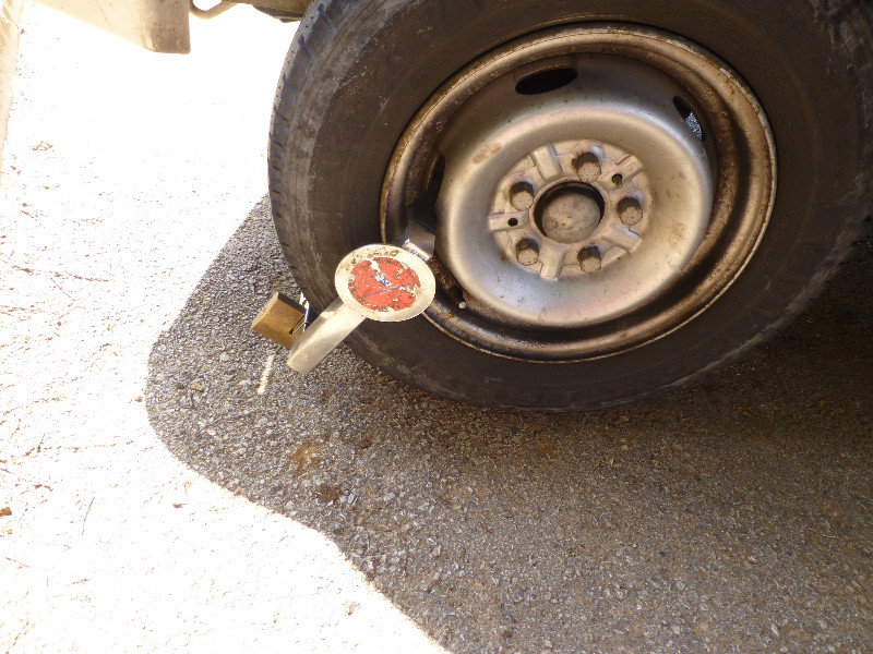Parking inspectors put a wheel clamp on our car at Rovinj on Istria Peninsula Croatia