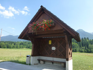 Voje Valley Bus Stop All buildings have hanging flower baskets