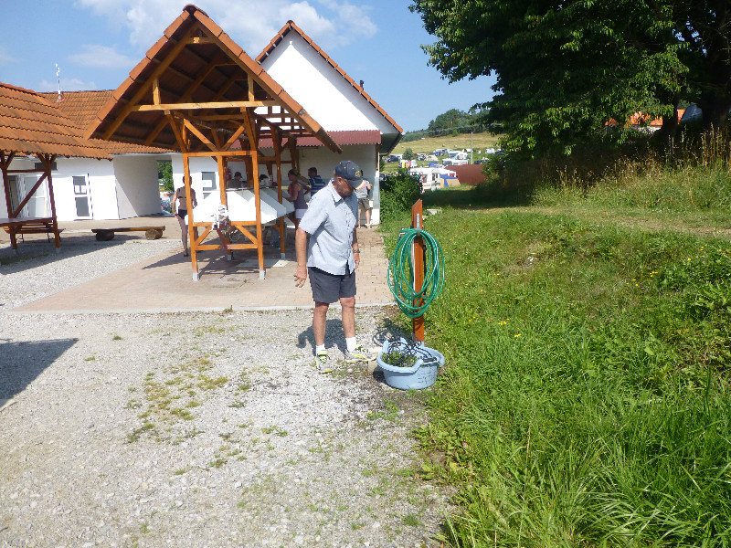 Using the hose to fill the water tank of the motor home