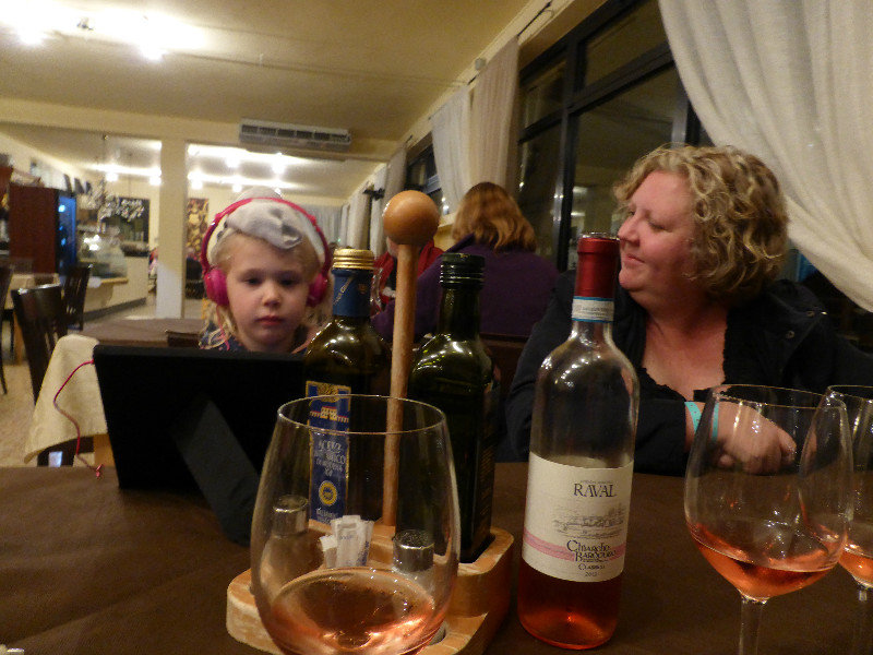 Gemma watching the iPad while we have dinner in Lake Garda restaurant