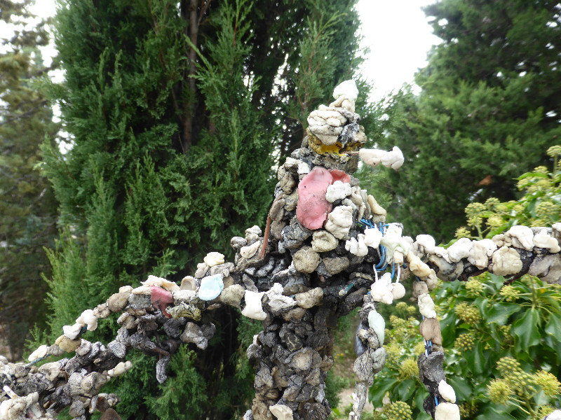 Look closely its made of chewing gum on a fence in Assisi in Umbria Italy