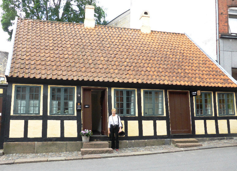 Pam infront of Hans Christian Andersons childhood house in Odense Denmark