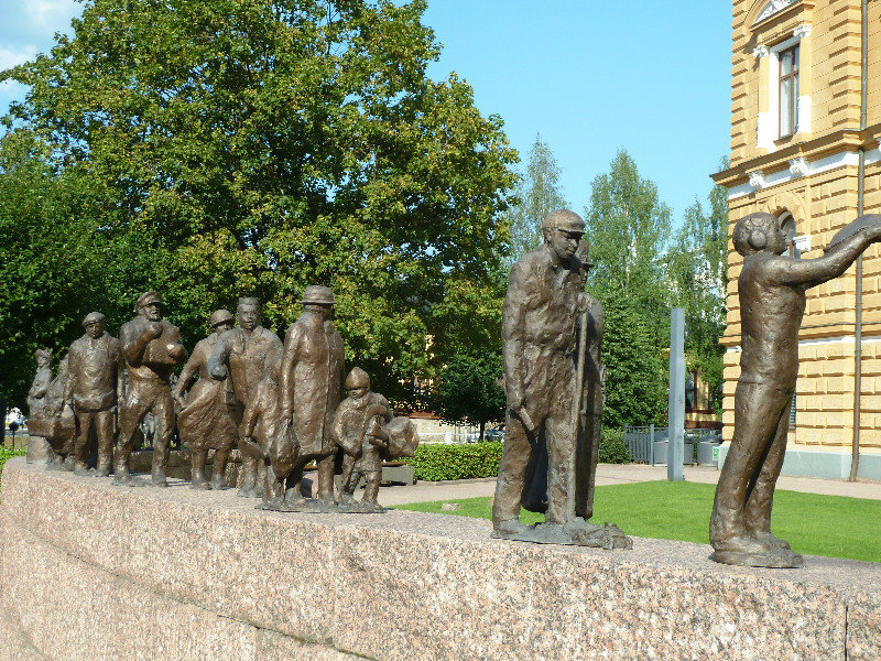 Bronze figures representing people from different periods in Oulu Finland (2)