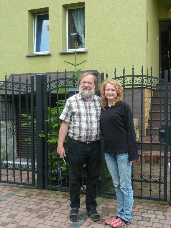 Agnieszka and her Dad Darek in front of their home