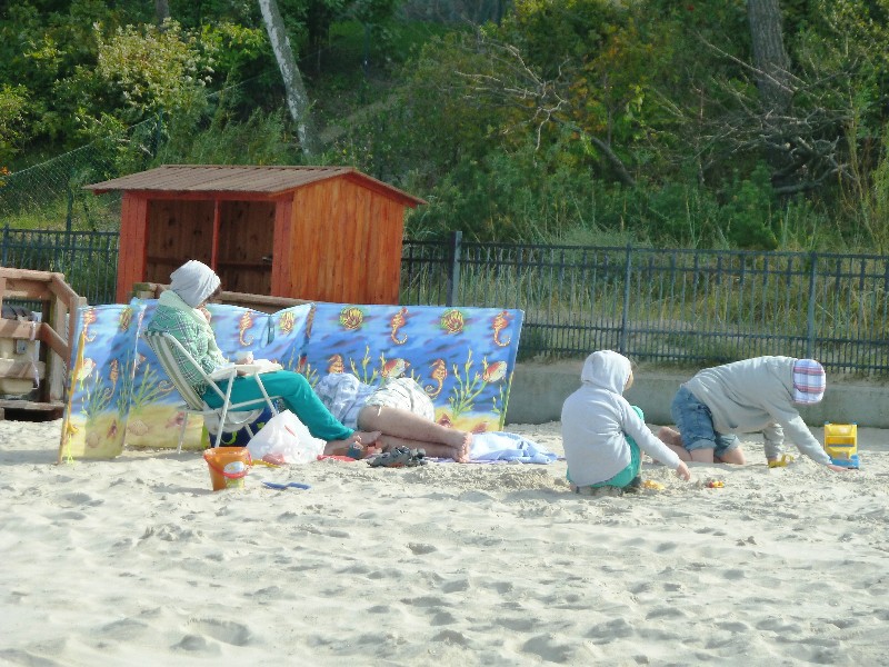 Leba on north coast of Poland - how the locals play on the beach - in hoodies and blankets