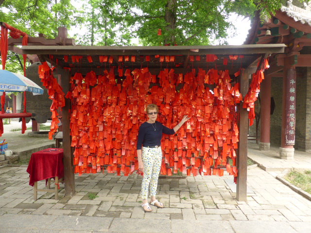 Pam at Wild Goose Pagoda in front of many messages
