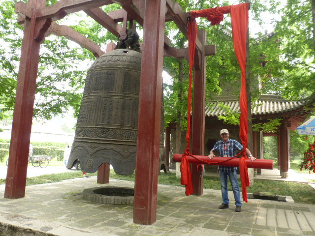 Tom sounding the bell - vibration creates a water fountain at Wild Goose Pagoda