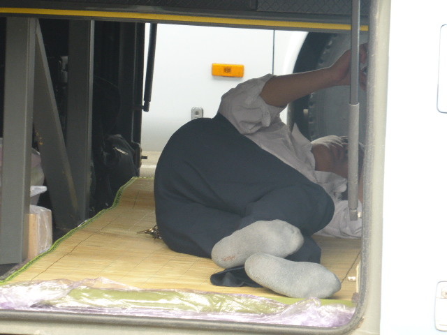 How the bus driver takes a nap - in the luggage section of the bus (1)