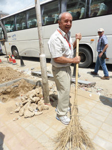 The oldest member of our travel group taking over the cleaning role in Zhengzhou