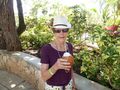 Pam enjoying coconut juice at Polynesian Cultural Centre