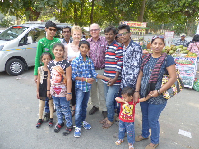 Pam & Tom in Udaipur with local tourists - they are fascinated with our hair and skin