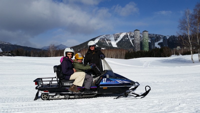 Tom, Gemma & Pam driving on a snowmobile