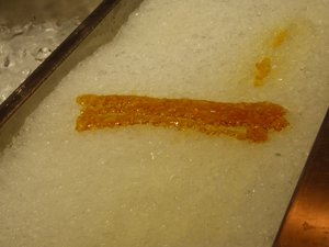 Maple Syrup frozen on ice turning into toffee (1)